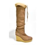 YVES SAINT LAURENT; a pair of tan sheepskin wedged boots with an 11cm heel, size 38.Additional