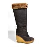 YVES SAINT LAURENT; a pair of 100% sheepskin dark brown wedged knee boots with a heel of 11cm,