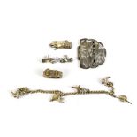 Three late 19th/early 20th century silver brooches/pins modelled as hands, a scarf clip modelled