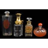 A collection of four glass perfume bottles including a cased example Houbigant 'La Parfum Idéal',