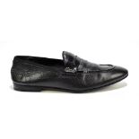 GUCCI; a pair of black soft leather gentleman's loafer slippers with silver tone Gucci logo to the