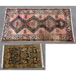 An Eastern runner with geometric and floral detail on a salmon ground, approximately 203x104cm,