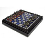 THE FRANKLIN MINT; 'The Gold & Silver Edition Waterloo Chess Set', with board, boxed.Additional