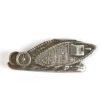 An early 20th century silver brooch modelled in the form of a WWI tank, stamped 'Silver', to