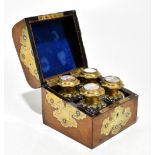 A good 19th century walnut and brass bound box housing four clear glass scent bottles with gilt