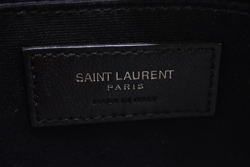 YVES SAINT LAURENT; a black leather shoulder bag with silver tone 'YSL' logo to front, a zip top, - Image 6 of 7