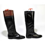 GUCCI; a pair of black flat leather riding boots with Gucci logo embossed to the side, size 39,