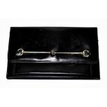 GUCCI; a black leather clutch bag with silver tone horsebit buckle across the front,  flap front