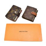 LOUIS VUITTON; a monogram brown canvas leather card holder with plastic card slips (twenty four