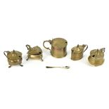 Five hallmarked silver lidded mustards, including a cylindrical example by Edward Barnard & Sons