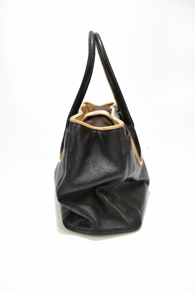 CHANEL; a 'Cerf Tote' shoulder bag circa 2008/9 with black soft calfskin leather edged with tan - Image 5 of 6