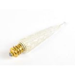 A Victorian cut glass pencil shaped perfume bottle with gilt metal collar and hinged cover, inset