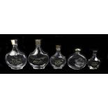 NINA RICCI FOR LALIQUE; five clear glass perfume bottles including an example of oval form with