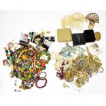 A group of costume jewellery including earrings, bead necklaces, simulated pearls, gold coloured