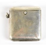 An Edward VII hallmarked silver vesta case with twin internal compartments and ring loop attachment,