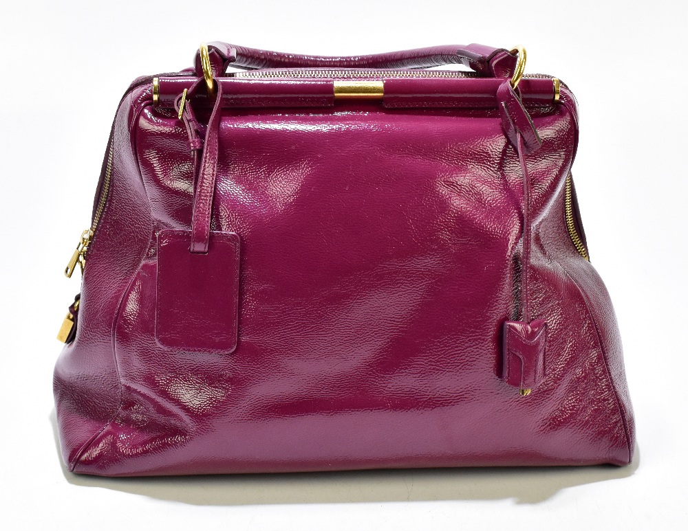 YVES SAINT LAURENT; a large claret coloured 'Muse' gloss patent leather messenger handbag with