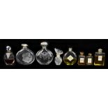 A collection of Art Deco and later perfume bottles including a French 'Surrender' example, various