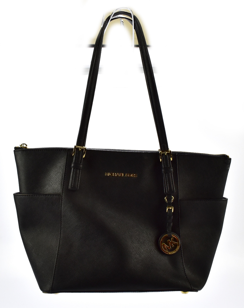 MICHAEL KORS; a black jet set leather tote bag with gold tone hardware base studs, zip, buckles - Image 6 of 7