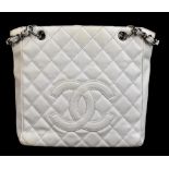 CHANEL; a white caviar petite tote bag, with white quilted caviar leather, stitched double 'C'