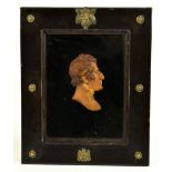 THOMAS WYATT; a 19th century wax diorama depicting a bust of Wellington, in brass mounted stained