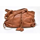 CARLOS FALCHI; a tan soft leather shoulder bag with drawstring sides, magnetic closures and