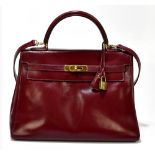HERMES; a circa 1970s/80s red calfskin leather 'Sienne Epsom KELLY Retourne 32', with impressed '