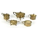 Five hallmarked silver lidded mustards, including a lobed example, Birmingham 1901, one example with