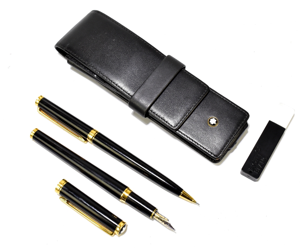 MONT BLANC; a fountain pen with 14ct gold nib and propelling pencil in simple leather wallet.