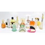 A quantity of designer perfume bottles including Gucci, Salvador Dali, YSL, Chloé, Vanderbilt,