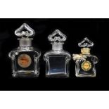 BACCARAT; three clear glass 'Guerlain' perfume bottles including a cased example, two complete