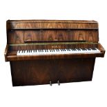 BENTLEY; a rosewood effect upright piano with iron frame, length 143cm, height 110cm, depth 52cm.