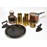 A collection of assorted metalware to include a copper, various trench art shells, a copper