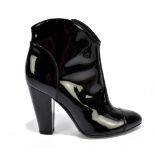 BURBERRY; a pair of black patent leather short heeled ankle boots with a zipped size, height of heel