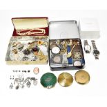 A quantity of costume jewellery including decorative brooches, a small group of compacts, a