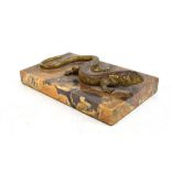 A marble desk paperweight with bronze lizard surmount, 16.8 x 9.7cm.Additional InformationSome