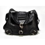 CHRISTIAN DIOR; a limited edition black python leather shoulder bag with side pockets, antiqued