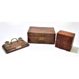 A Victorian mahogany writing slope, the hinged cover enclosing a tooled leather inset slope and