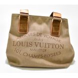 LOUIS VUITTON; a limited edition beige canvas tote bag with 'Articles de Voyage Paris' to the front,