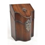 A George III mahogany knife box with white metal lined fitted interior housing a set of twelve