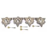 Four Victorian hallmarked silver salts of triangular form with repoussé decoration, Sheffield