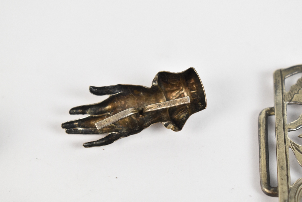 Three late 19th/early 20th century silver brooches/pins modelled as hands, a scarf clip modelled - Image 4 of 5
