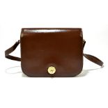 GUCCI; a brown epi leather D-shaped cross body shoulder bag, with front flap and gold and silver