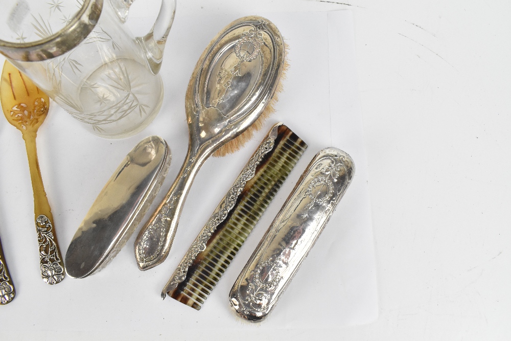 A group of hallmarked silver mounted items to include a cut glass water jug with hallmarked silver - Image 3 of 8