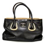 CHANEL; a 'Cerf Tote' shoulder bag circa 2008/9 with black soft calfskin leather edged with tan