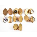 Three pairs of gold plated cufflinks, one pair featuring compasses, and a further single enamelled