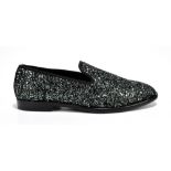 JIMMY CHOO; a pair of lady's slip-on 'Marlow' loafers with midnight blue coarse glitter fabric,