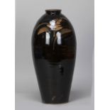 DAVID LEACH (1911-2005) for Lowerdown Pottery; a tall stoneware bottle covered in tenmoku glaze with