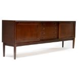A retro Brahmin mahogany sideboard with four central drawers flanked by sliding doors,