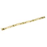 A 19th century 15ct fancy link gold gate bracelet with four bezel set peridot stones,