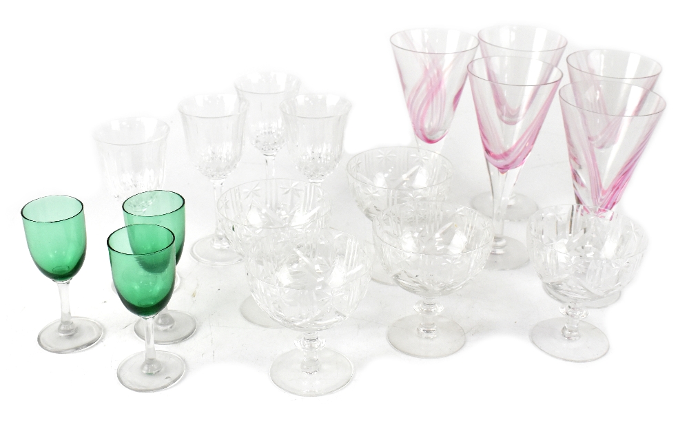 A quantity of cut glass and other drinking glasses to include wine glasses, Champagne glasses, etc.